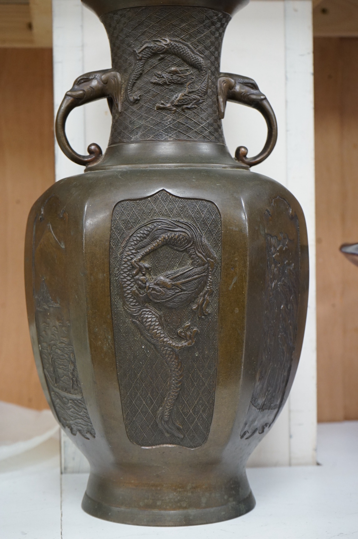 An early 20th century Japanese bronze vase with twin ‘elephant’ handles, 39cm. Condition - good